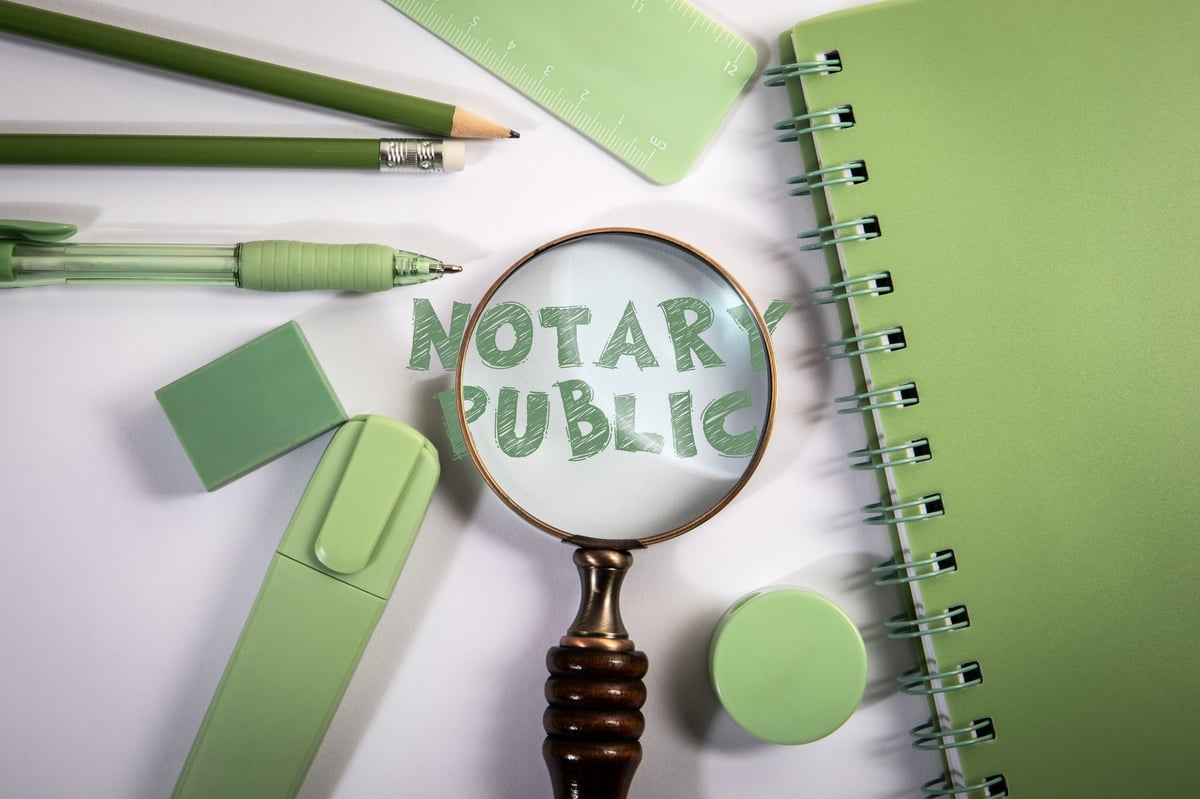 Notary public concept with a magnifier and legal office documents